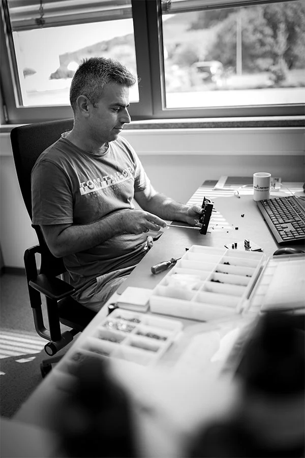 Syamand Ismail sitting on his desk