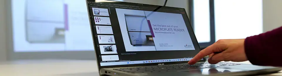 A laptop with a BMG LABTECH webinar